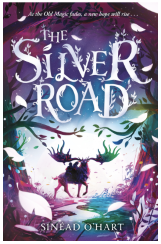 The Silver Road, small book cover. A huge stag stands on a silver track. Two children ride on its back. There are trees either side and white falling leaves. The title is in white and laid out as though the words are wade of or entwined by vines. The book's cover is in muted green, blue and purple which defines the ground and trees. There seems to be a bluepurple night sky behind the stag. The books tag line reads: As the old magic fades, a new hope will rise.
